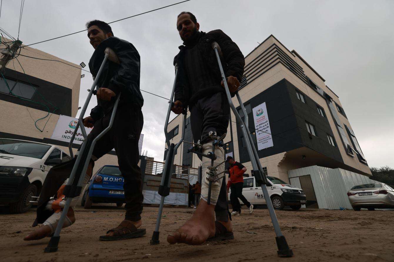 Injured patients near the entrance of Rafah Indonesian Field Hospital in Gaza.