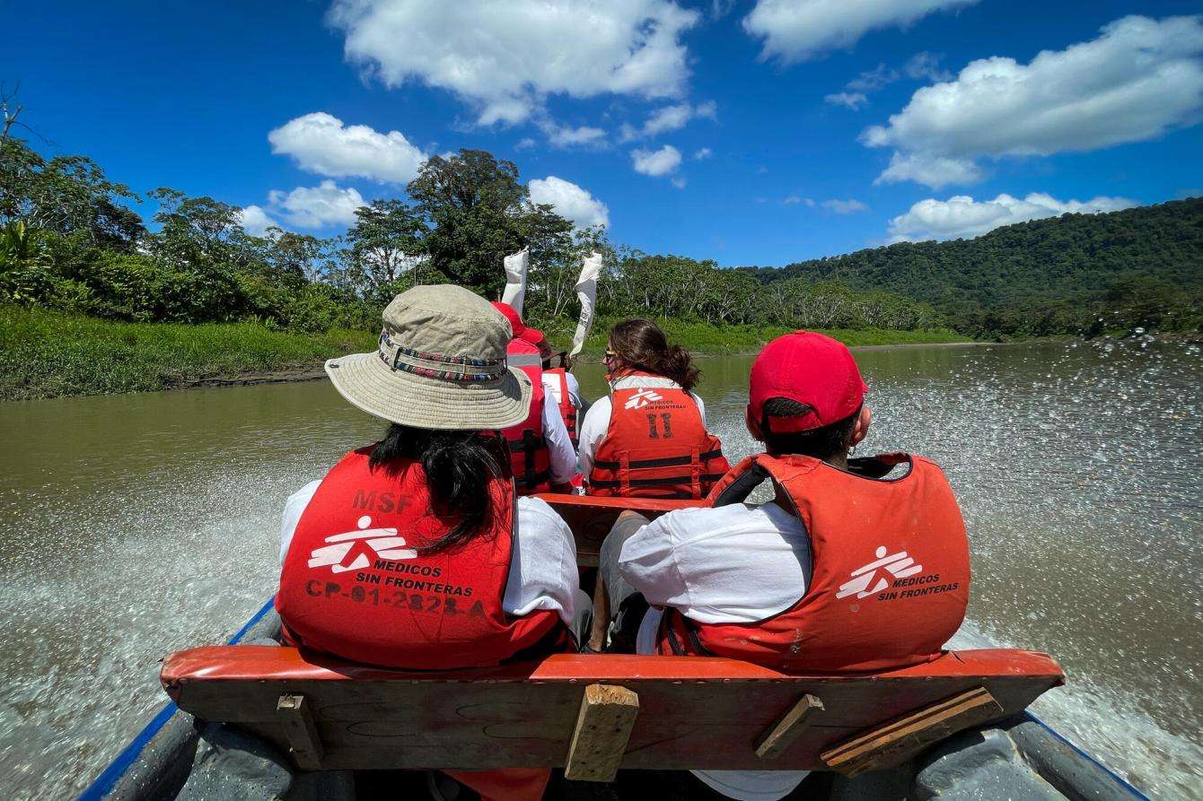 MSF staff members visiting a community by boat in Colombia.