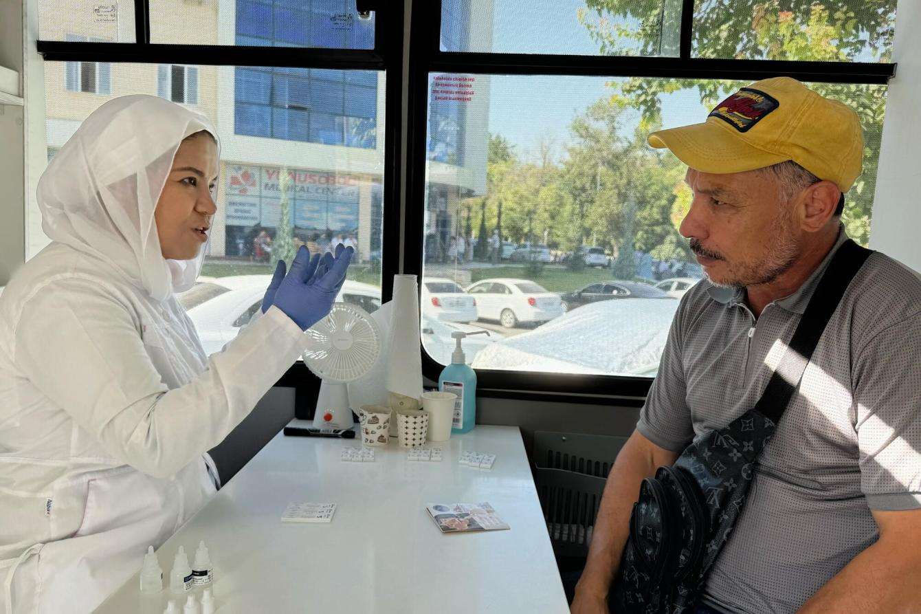 Dr. Abidova talks to a client in Uzbekistan