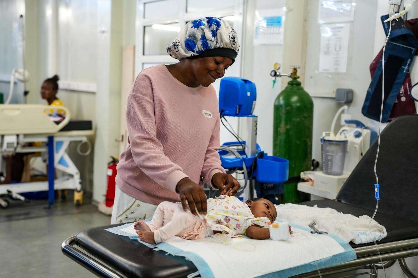 “I want to go home, but I can't," says Nerlande of her home neighborhood, from which she was displaced. Her baby was admitted to the emergency department in need of an ultrasound to confirm a possible case of peritonitis. 