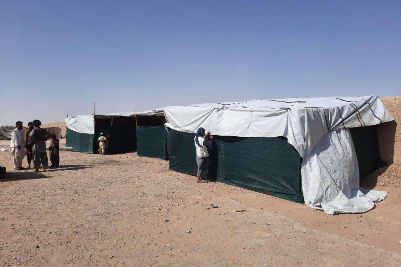 Tents are set up in the desert in Afghanistan. 