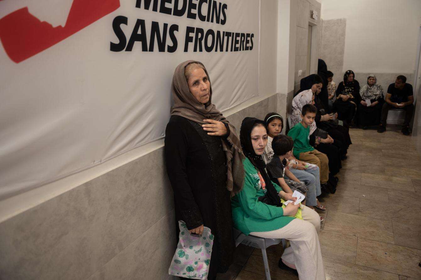 Patients wait to be seen at an MSF-run clinic in Tehran, Iran.