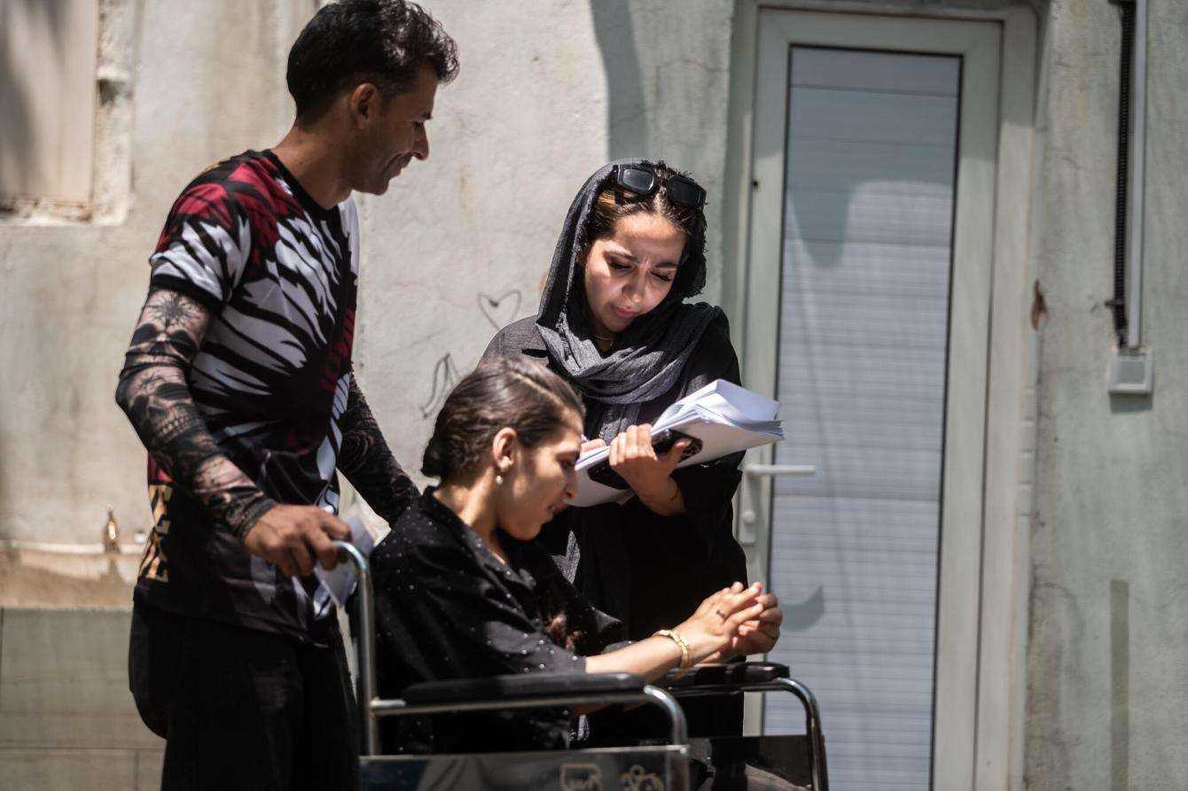 People register at Mehr clinic, which sees an average of about 180 patients each day for a wide range of medical services.