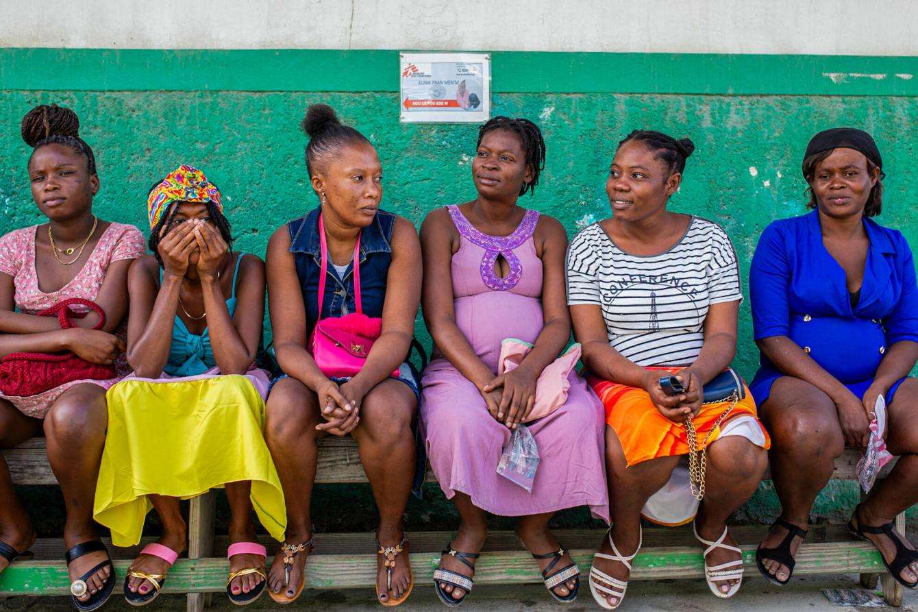Women wait to be seen at a maternity hospital in Haiti. 