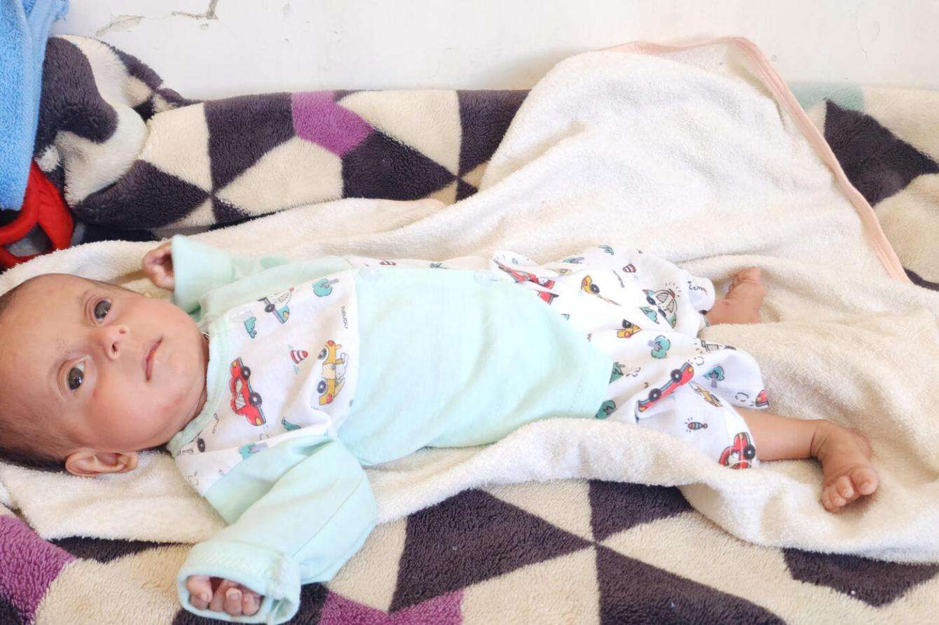 Abdulmalik, a 4-month-old boy from Al-Abdiah district, Marib governorate, is prepared for discharge from the intensive therapeutic feeding center at Rada'a Hospital in Al-Bayda after completing treatment.