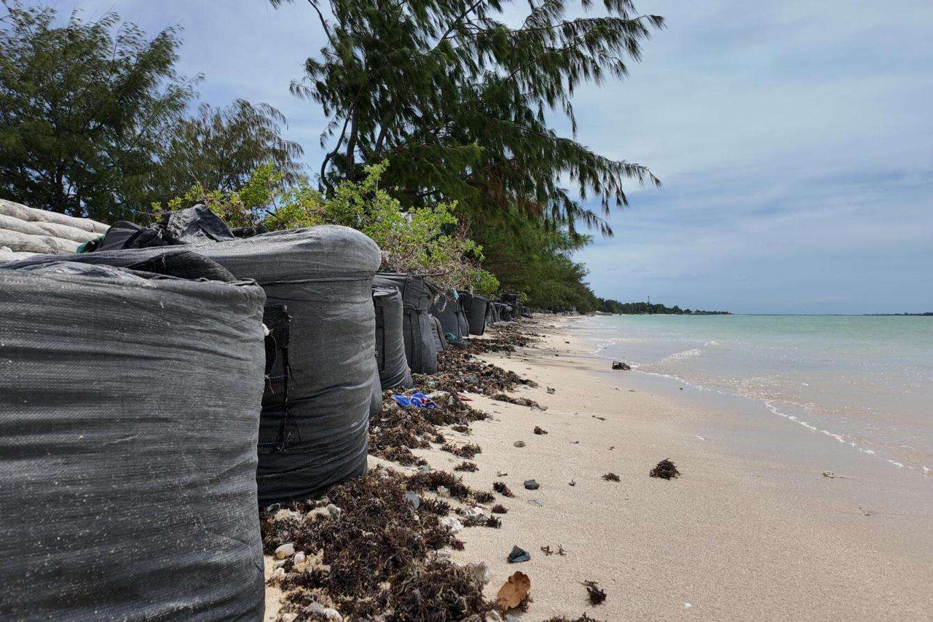 A sea wall built in response to rising sea levels and changing weather patterns in Tarawa, Kiribati.