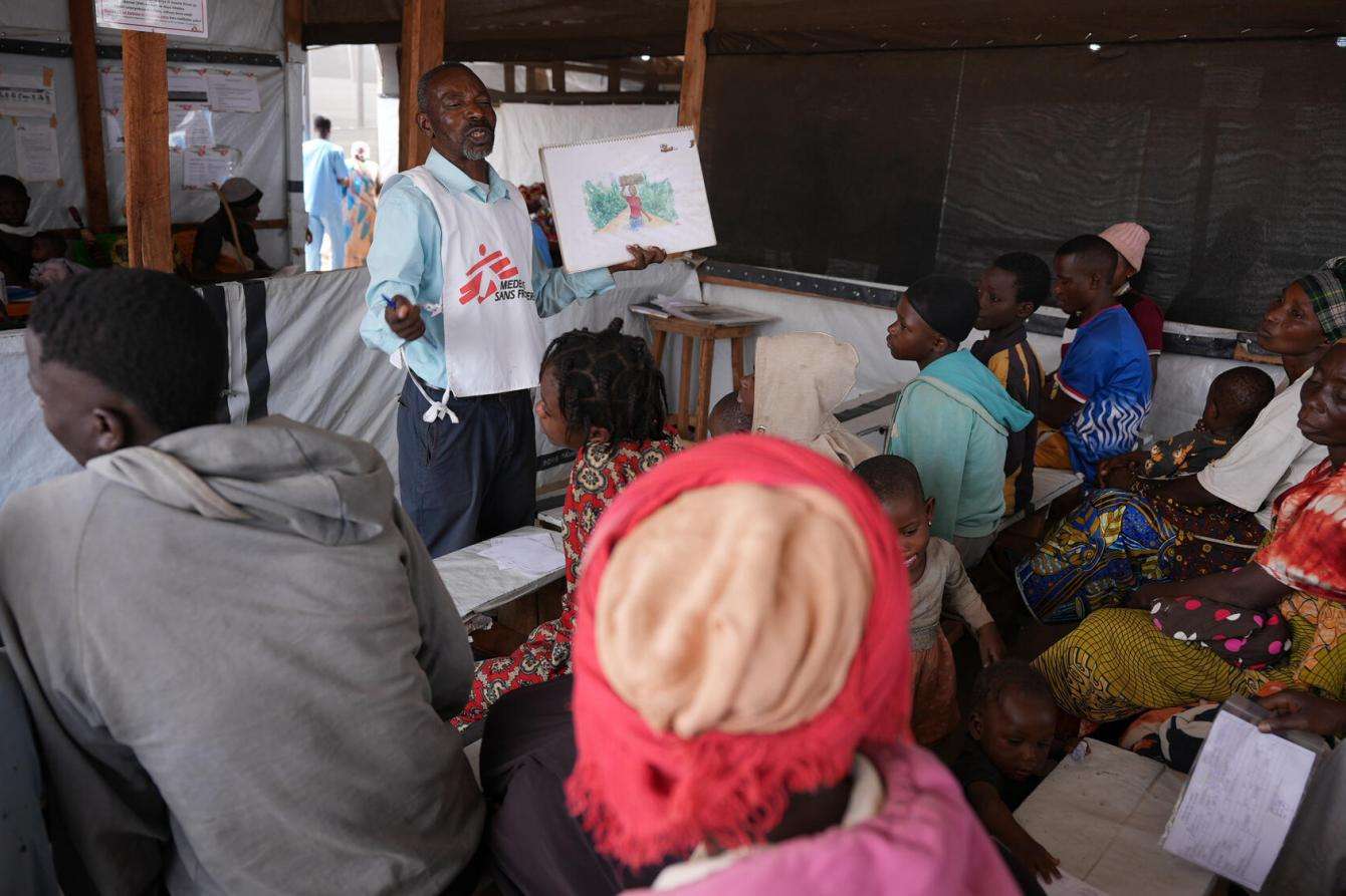 A health worker conducts a mental health awareness session in Burundi. 