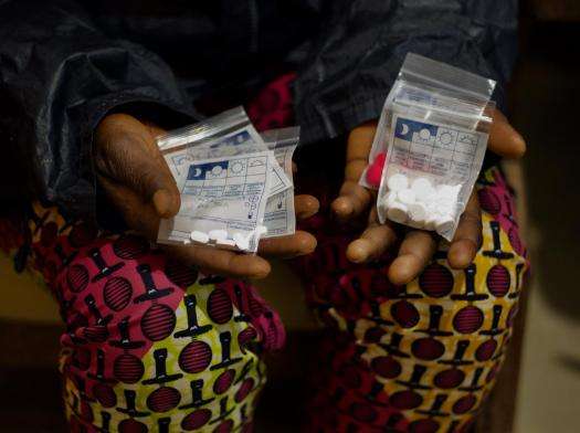 A person holds bags of drugs used for an abortion