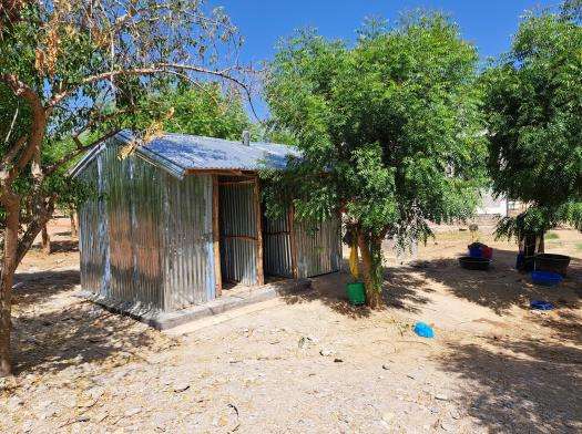 MSF-built metal latrines outside next to trees in Tigray, Ethiopia