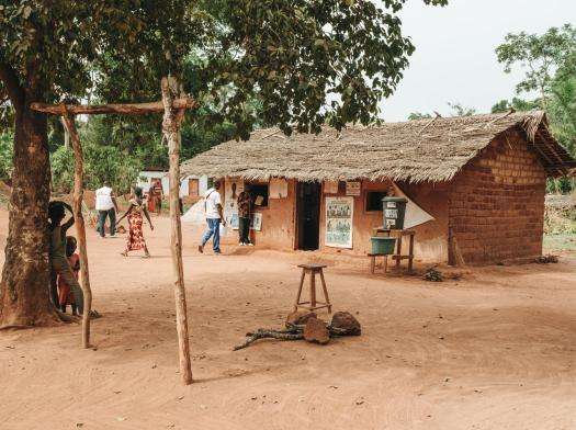 The small brick building and grass roof of MSF-supported Baliguini health post in Central African Republic.