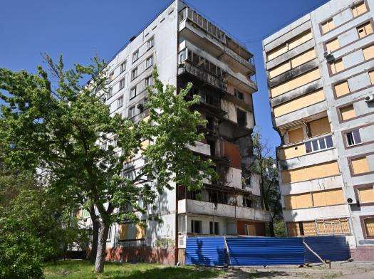 Damaged buildings against blue sky after a Russian missile strike in Zaporizhzhia, Ukraine