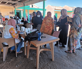 An MSF mobile clinic and displaced patients in Port Sudan.