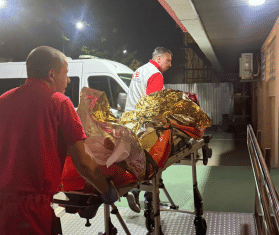 MSF teams transport a patient on a stretcher after a Russian attack on Ukraine.