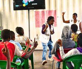 MSF staff lead youth in an ice breaker session at the Dandora Youth Friendly Center in Nairobi, Kenya.