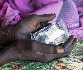 An HIV/TB patient holds medication in South Sudan. 