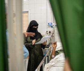  Dr. Reem checks on patients in the intensive care unit at Mokha Hospital.