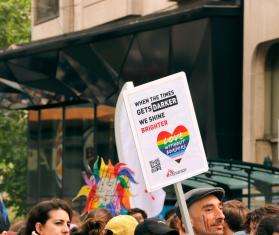 MSF staff hold a Love Without Borders sign at a Pride march in Belgium. 