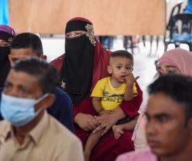 A Rohingya mother and child wait to be seen by the doctor at MSF's mobile clinic in Kepala Batas, Penang, Malaysia.