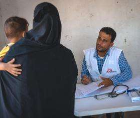 A mother takes her child for a checkup in Yemen. 