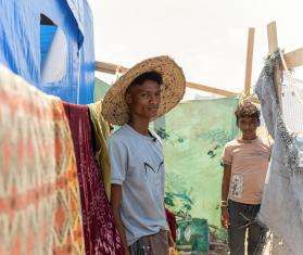 Displaced men in a camp in Yemen.