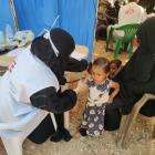 An MSF doctor examines a child during a mobile clinic for displaced people in Khudaish camp, Abs, Yemen. September 2020.