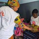 A midwife checks a mother and newborn in Mali. 