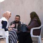 MSF staff speak with migrants in Libya.