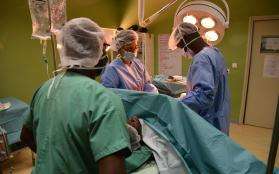 Surgical team perform a cesarean